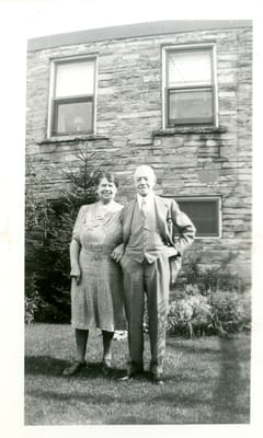 E. J. and Annie Lewis behind their Roehampton house.jpg