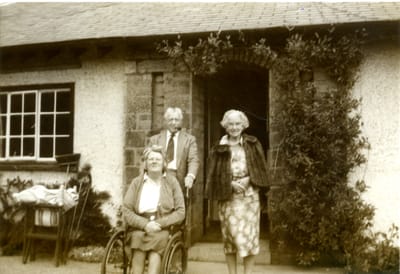 Jeff and Nellie (Hawkins) Lewis with daughter Janet (infantile paralysis).jpg