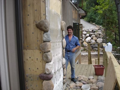 Ray putting stone on chimney.jpg