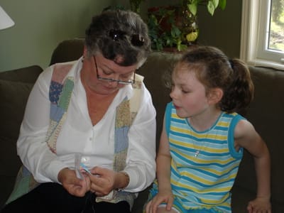 A011 GRANDMA REACHING SEWING.JPG